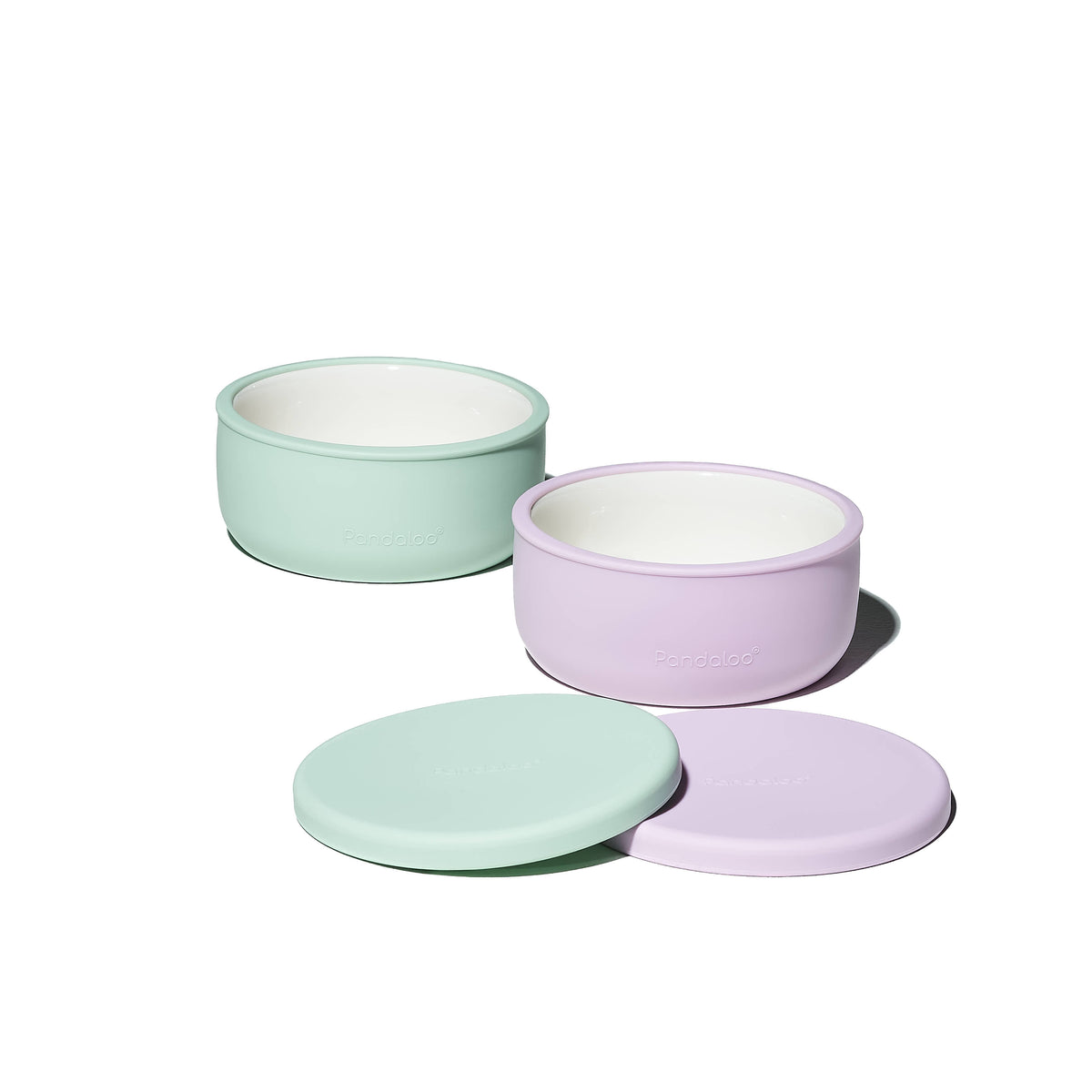 Two Pandaloo Kids porcelain bowls in Lilac Rhapsody and Sweet Sage with silicone lids