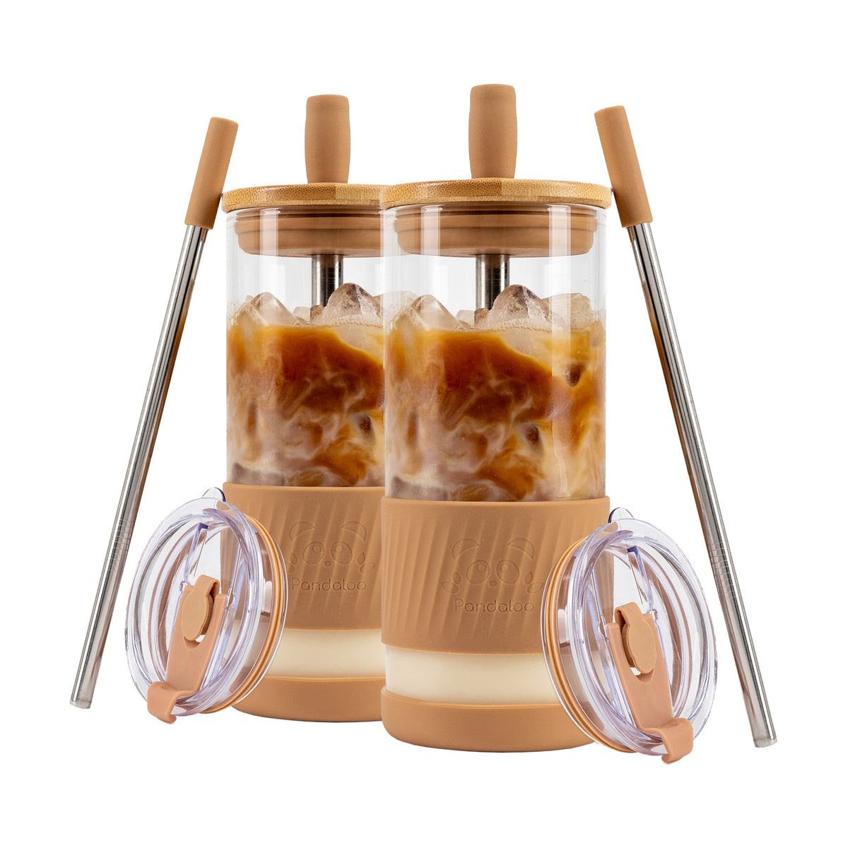 Two Pandaloo Original 20 oz glass tumblers in Amber Sand with bamboo lids, travel lids and stainless steel straws