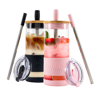 Two Pandaloo Original 20 oz glass tumblers in Black Saphir and Tender Pink with bamboo lids, travel lids and stainless steel straws
