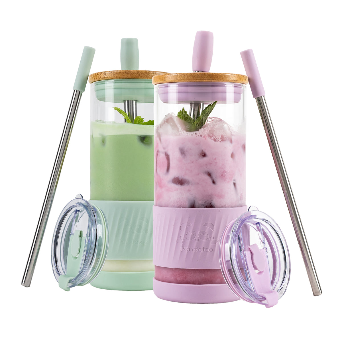 Two Pandaloo Original 20 oz glass tumblers in Lilac and Sage with bamboo lids, travel lids and stainless steel straws